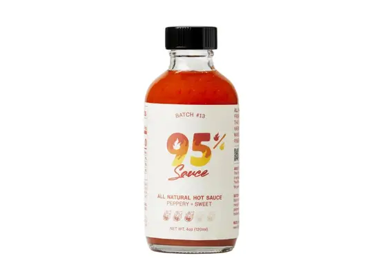 bottle of 95 hot sauce on a white
