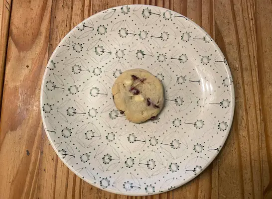 costco white chocolate cranberry cookie on printed plate.