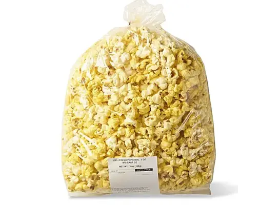 a clear plastic bag filled with popcorn.
