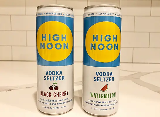 high noon cans on a counter.