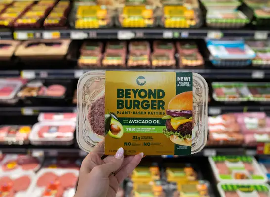 woman holding beyond meat