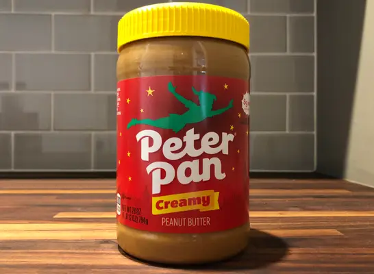 peter pan jar on a table.