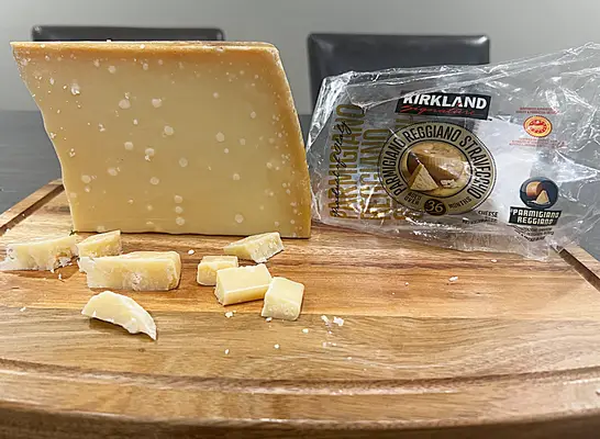 a block of kirkland parm reggiano straveccho cheese