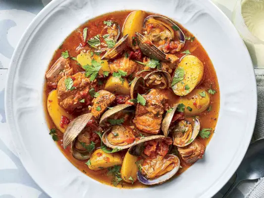 Brasato di maiale portoghese e vongole