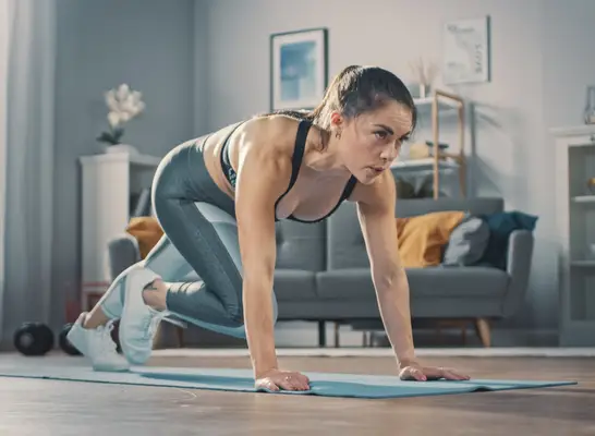 woman performs mountain climber exercise as part of weight loss workout