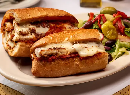 Pan-Fried Chicken Cutlet, Marinara Sauce, On A Toasted Hero Roll at Carmine