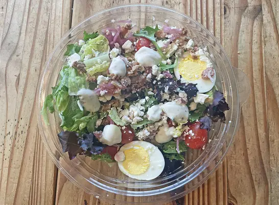 The new Ranch Cobb Salad at Panera Bread ona wooden table