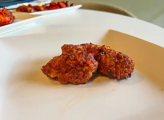 two korean wings on a plate.