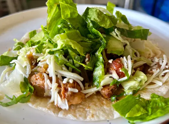 chipotle chicken tacon on a plate.
