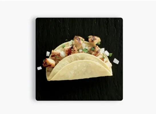 taco on a black plate