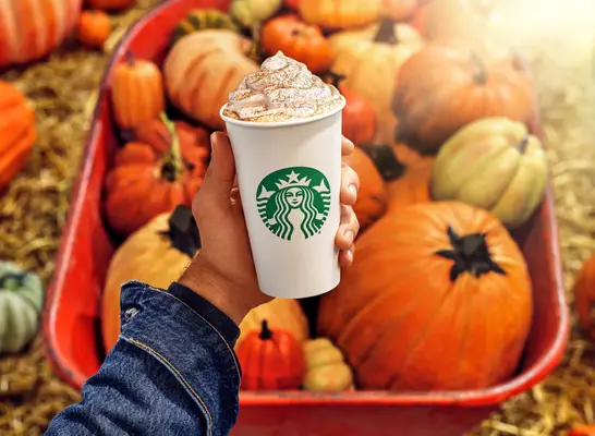 Person holding Starbucks