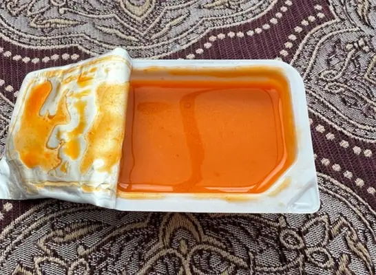 an open container of chick fil-a buffalo sauce