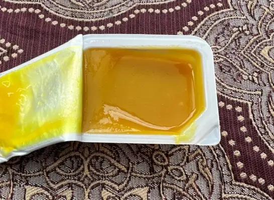 an open container of chick fil-a honey mustard