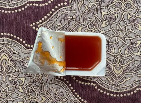 an open container of chick fil-a polynesian sauce