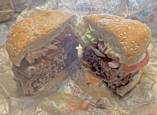 Burger King Triple Whopper cut in half