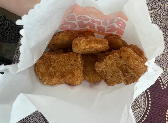 an open bag of burger king nuggets.