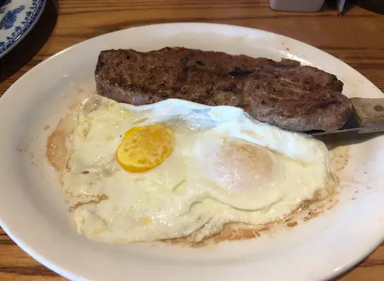 a plate of steak and eggs from cracker barrel