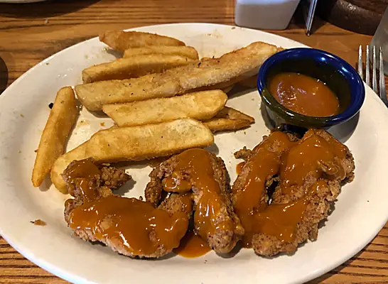 bee sting tenders and fries on a plate from cracker barrel