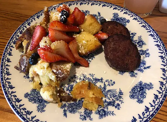 a plate of cracker barrel fresh berry french toast bake
