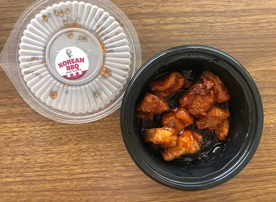 an open container of kfc nuggets.