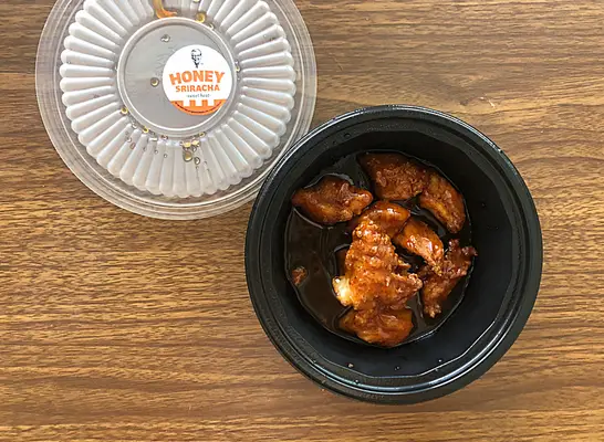 an open container of kfc nuggets.