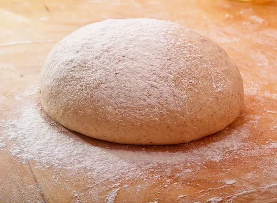 pizza dough ready to bake