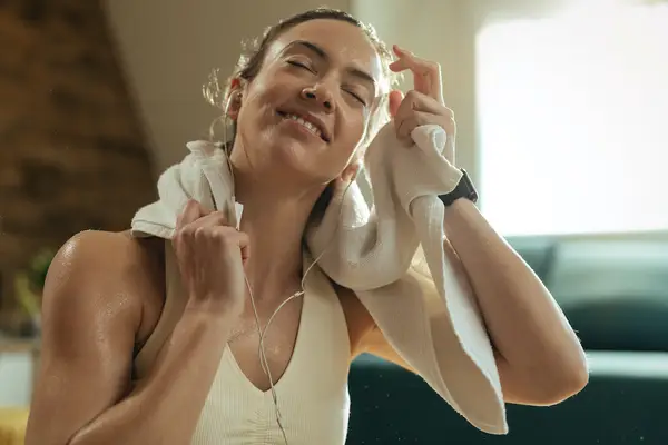woman happy and sweaty after workout