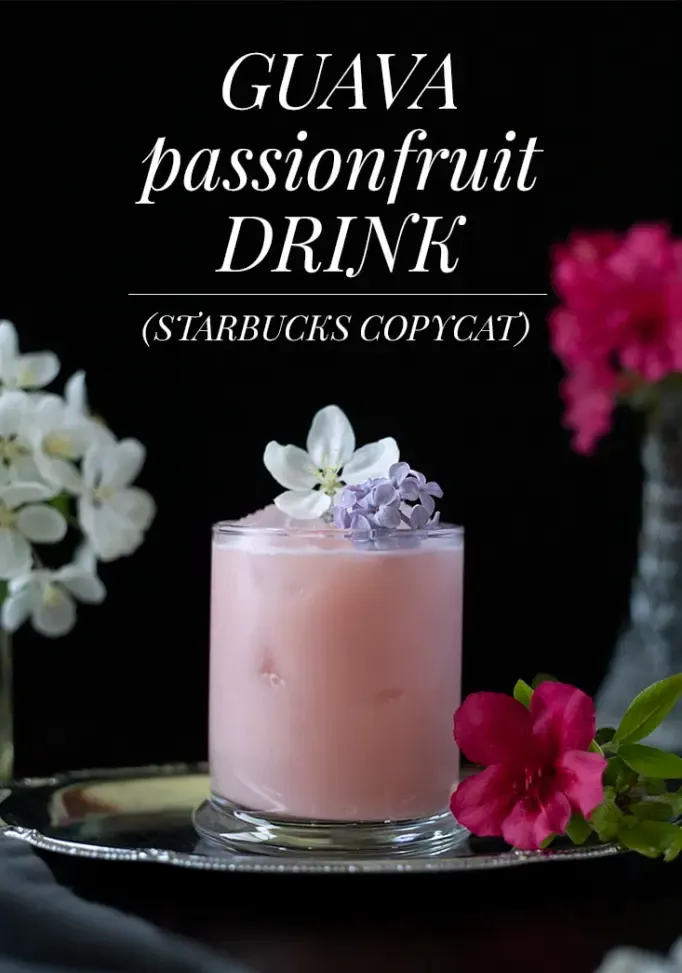 różowy napój w szklance z kwiatami i tekst o napoju Guava Passionfruit Starbucks Copycat' title=