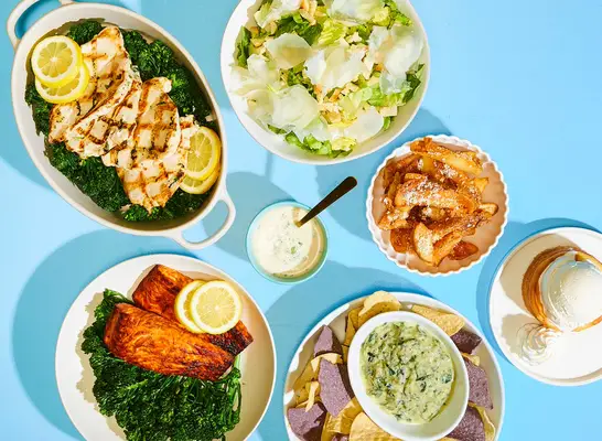 blue background with plates of california pizza kitchen